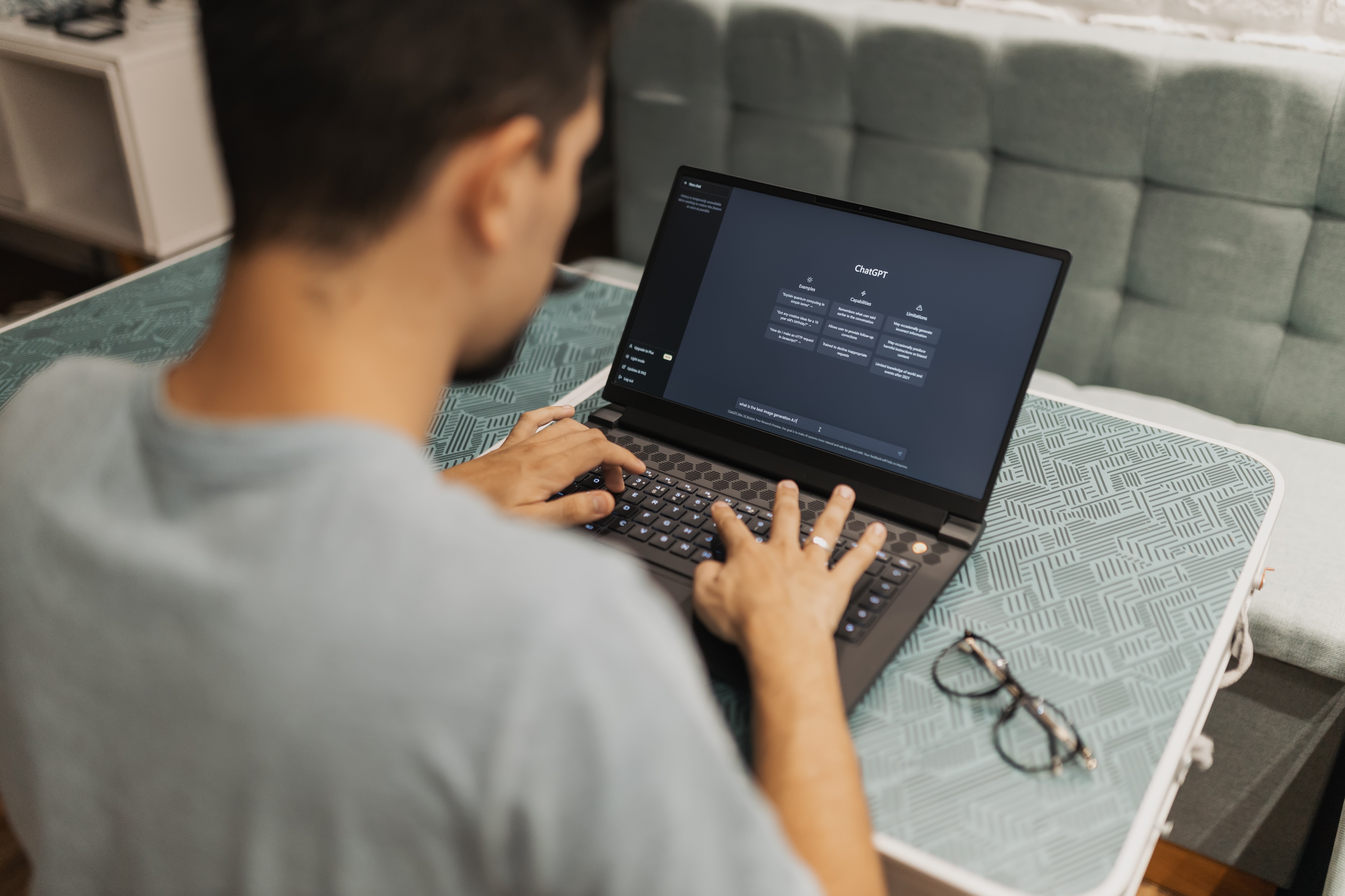 Man on laptop using ChatGPT
